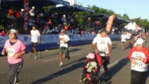 A competitor on crutches (one leg) and another with a stroller