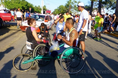 Competitors in wheelchairs after the race