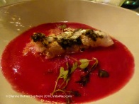 3. Course 1: Corbina a la plancha with black olives and beet-root sauce and derramán seeds from Japan. Served with Chilean daub blanc.